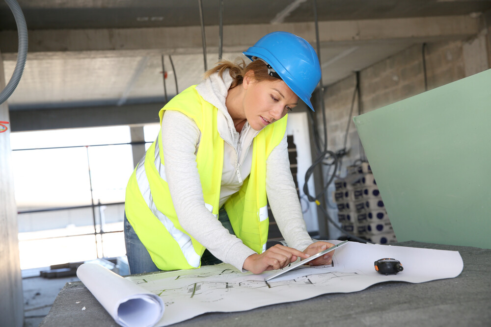 Lady looking at building plans